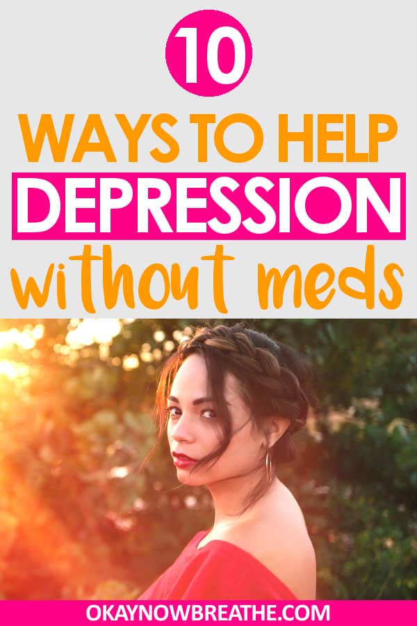 A female with her brunette hair in a bun wearing a red top. The sunshine is shining towards here. Text says 10 ways to help depression without meds