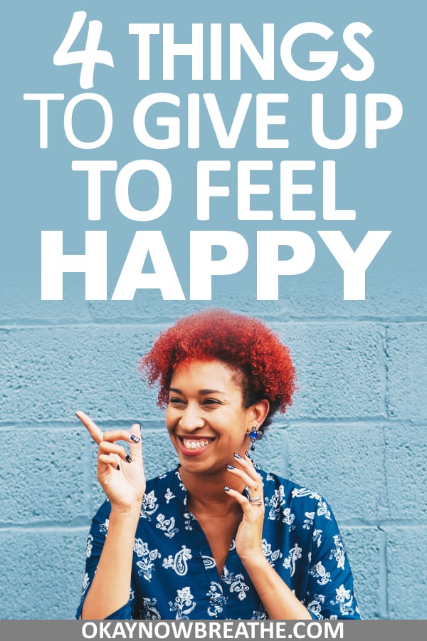 Female with red afro smiling and pointing. Text overlay says 4 things to give up to feel happy