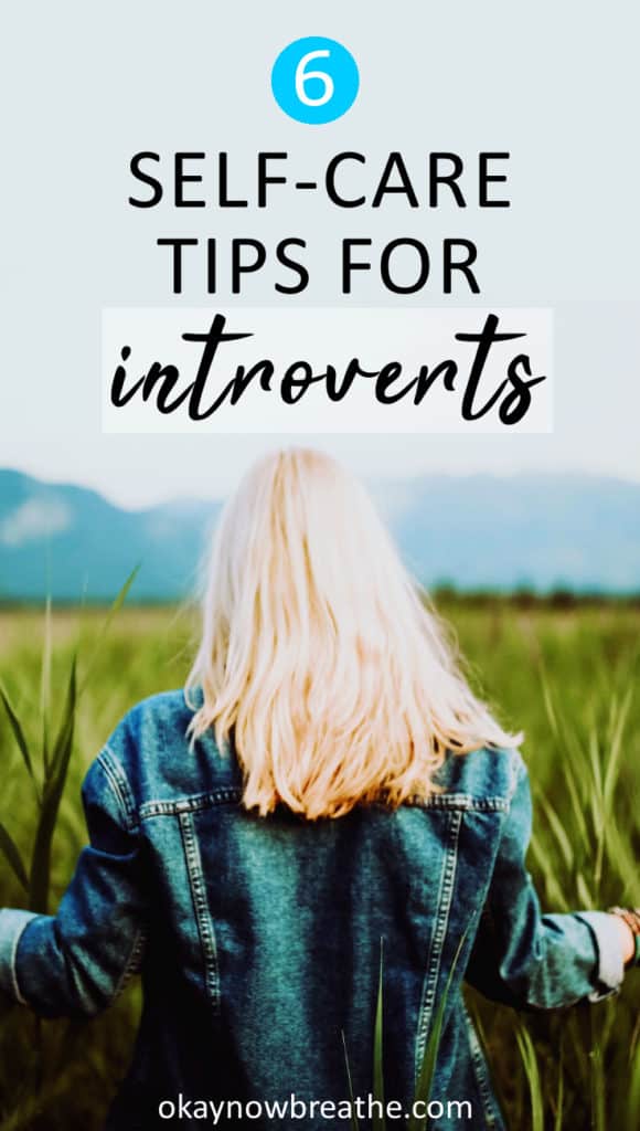 Blonde female walking through talk grass towards a mountain. Text overlay says 6 Self-Care Tips for Introverts