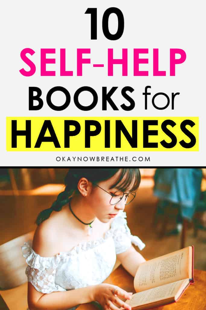 Female reading a book at a table. Text overlay says 7 self-help books for happiness