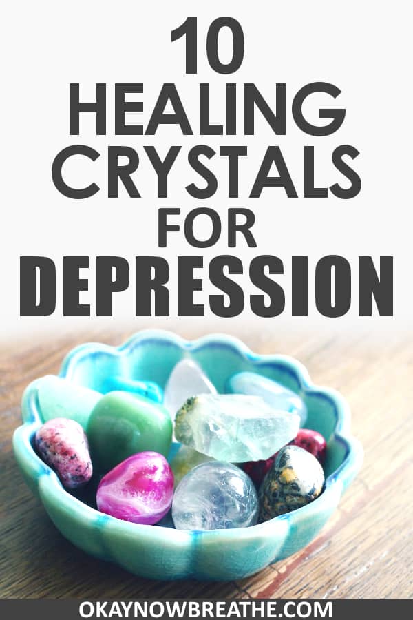 A variety of crystals and rocks in a blue green bowl with the text 10 Healing Crystals for Depression