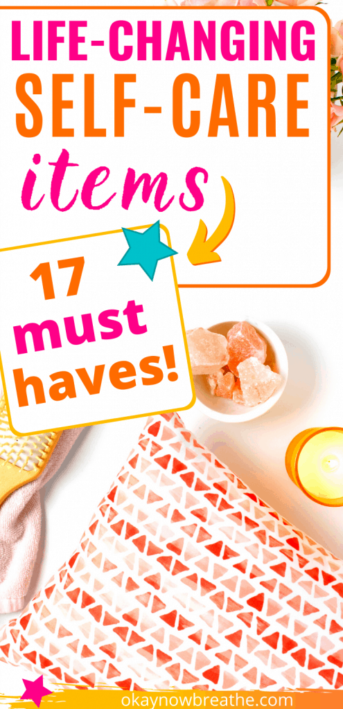 An orange bag next to orange crystals and a lit candle. Title text says life-changing self-care items. 17 must haves!
