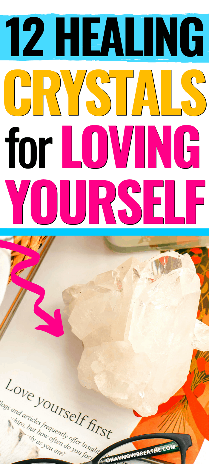 A clear white crystal on top of magazine that says, "love yourself first." Text overlay say 12 Healing Crystals for Loving Yourself