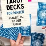 Blue tarot cards faced down. On image of paper, title says the best tarot decks for winter. seriously just buy them already