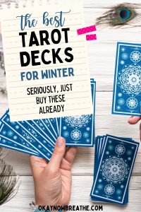 Blue tarot cards faced down. On image of paper, title says the best tarot decks for winter. seriously just buy them already