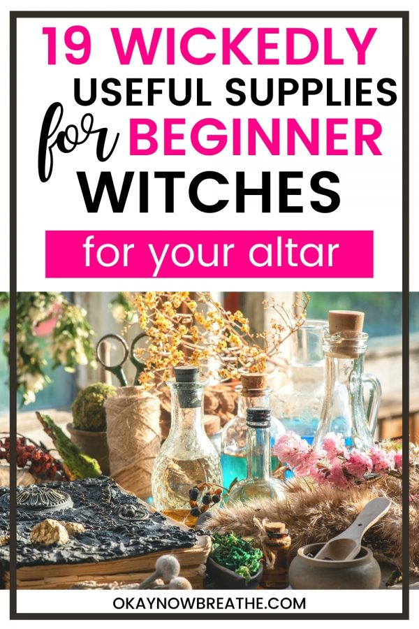 On a table there is a bunch of witch tools, such as dried herbs and flowers, glass bottles with spells and oils in them. Up top, the title says 19 wickedly useful supplies for beginner witches for your altar - okaynowbreate.com