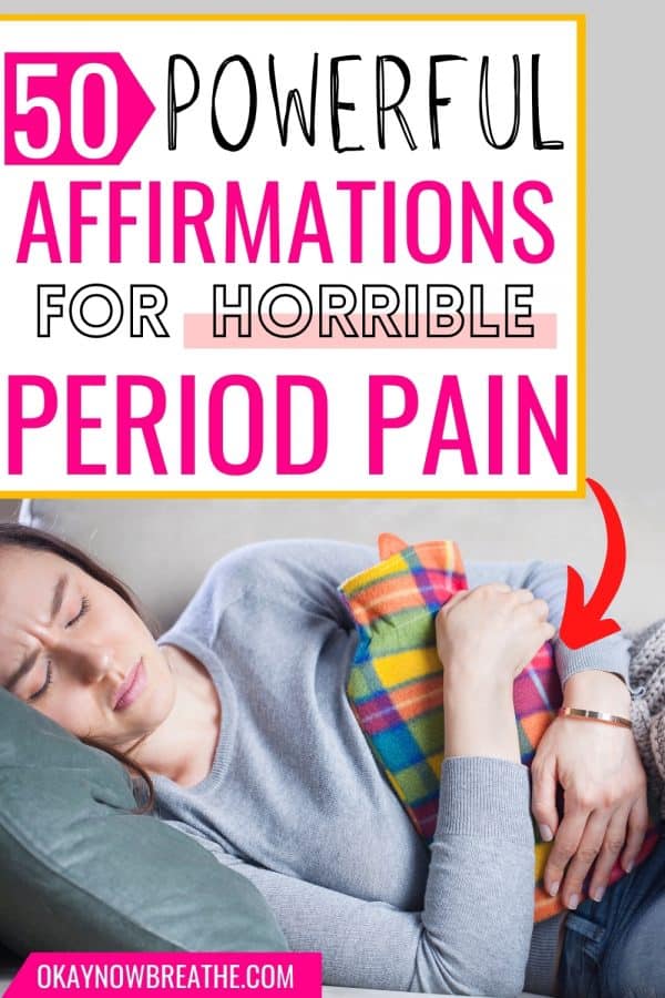White female in long-sleeved gray shirt laying down on gray pillow. She is closing her eyes and grimacing. She is also holding a multi-colored plaid hot water bottle to her body. There is title text that says, "50 powerful affirmations for horrible period pain - okaynowbreathe.com