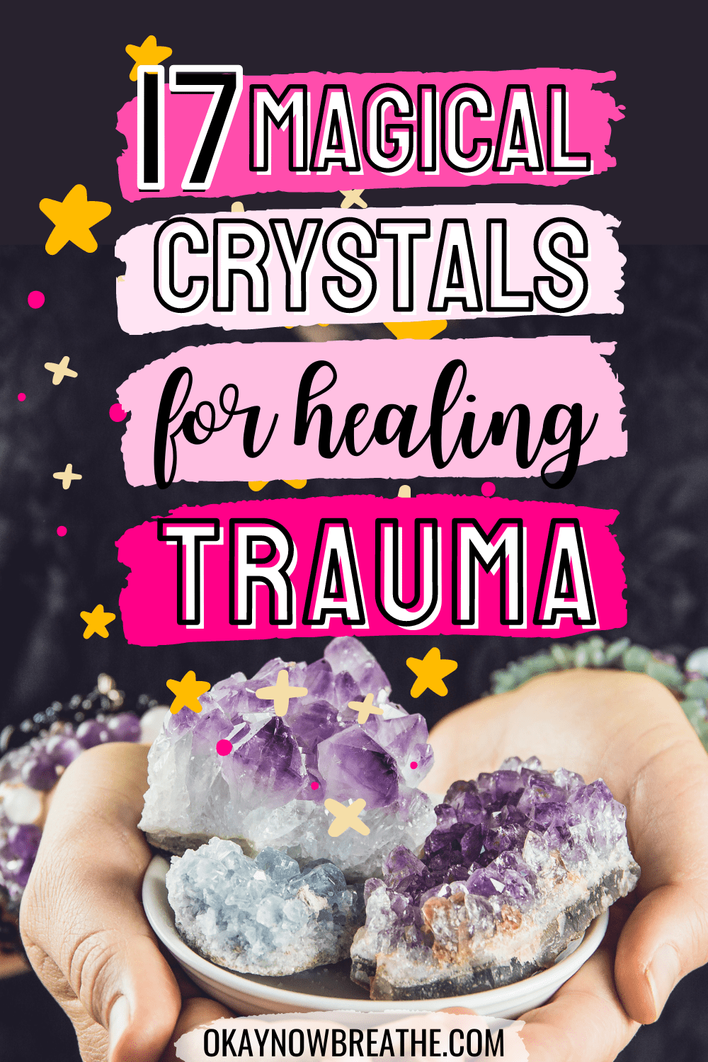 Hands are holding a small white bowl with amethyst cluster crystals. Text overlay says 17 magical crystals for healing trauma - okaynowbreathe.com
