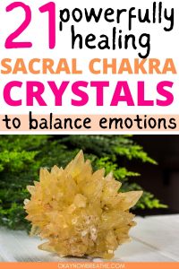 There is an orange calcite cluster next to a green plant. Text above it says: 21 powerfully healing sacral chakra crystals to balance emotions - okaynowbreathe.com