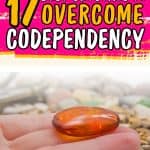 There is a palm folding a red crystal towards the fingers. Above, there is text that says, "17 best crystals to overcome codependency"